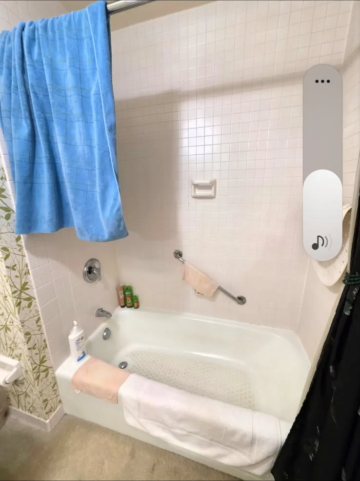 Original bathtub area showing worn tile and fixtures