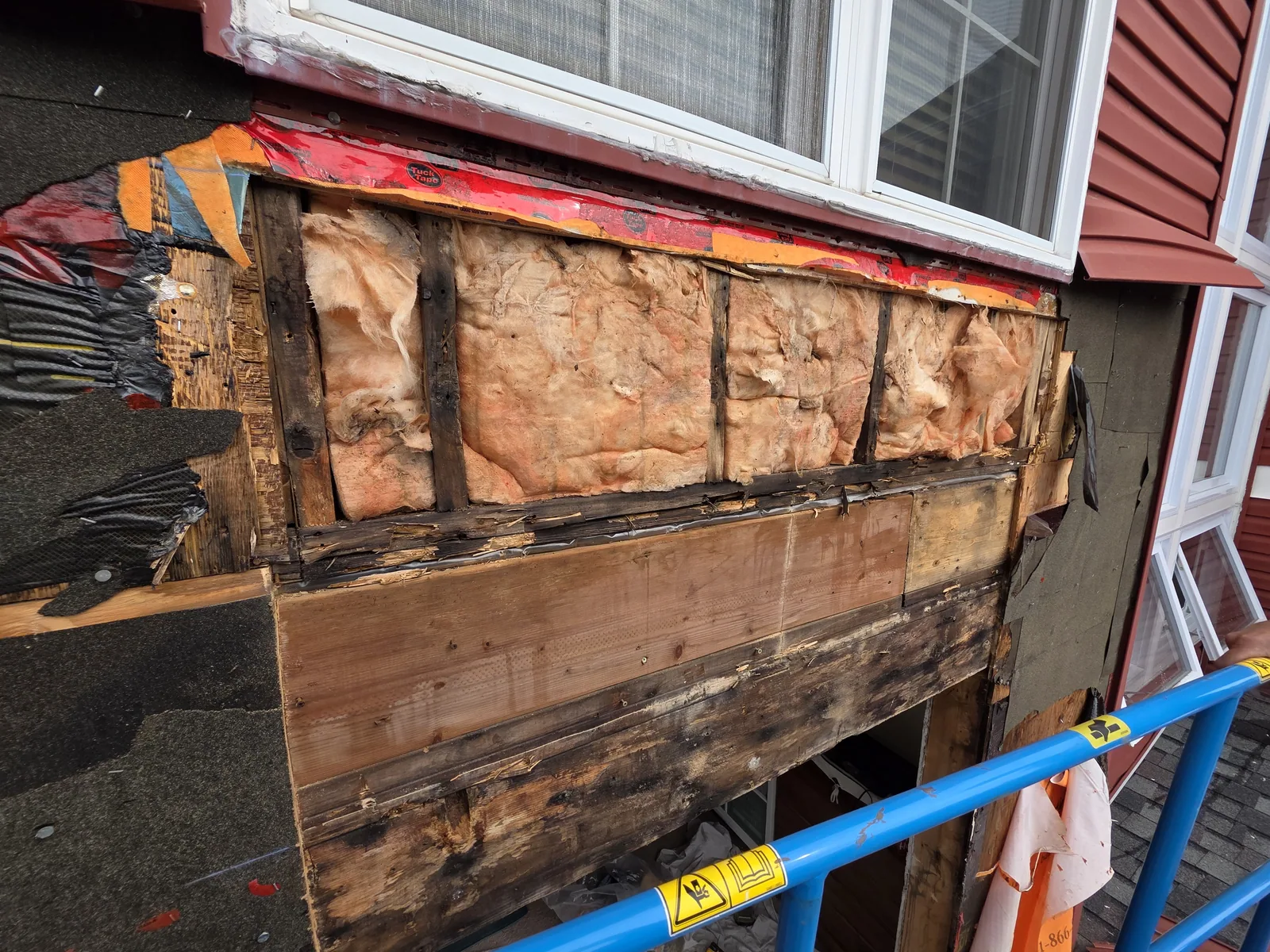 Exterior repair work in progress at height
